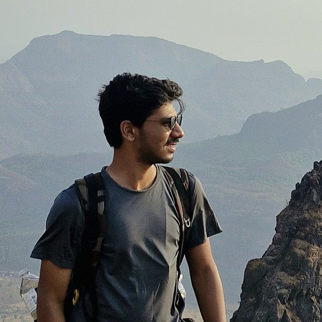 Aaditya Hasabnis on a mountain trail, mid-trek